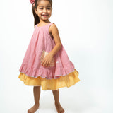 Pocketful of sunsets' sleeveless dress in peach pink with yellow frill in handwoven cotton