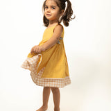 Old photographs sleeveless layered pinafore dress in yellow handwoven cotton
