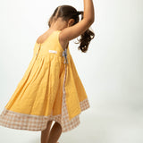 Old photographs sleeveless layered pinafore dress in yellow handwoven cotton